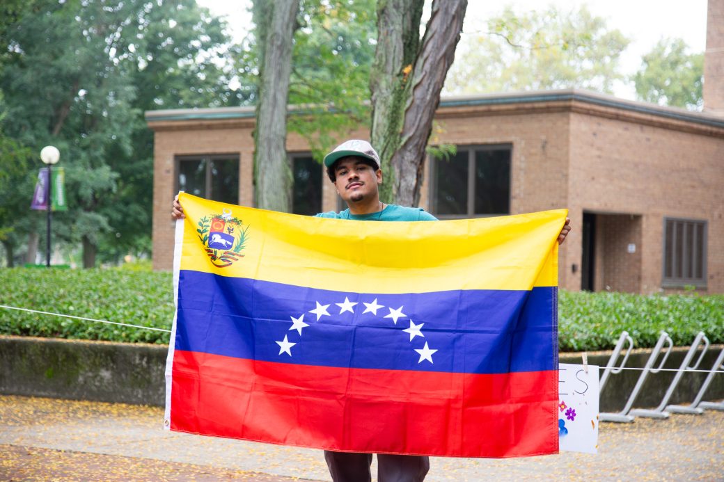 People with Venezuela's flag at Convocation and Celebration
