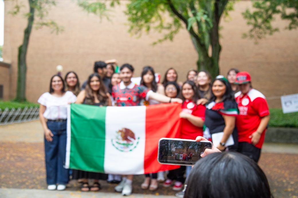 People with Mexico's flag at Convocation and Celebration