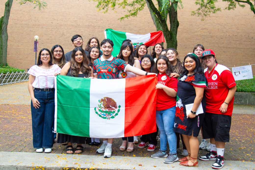 People with Mexico's flag at Convocation and Celebration