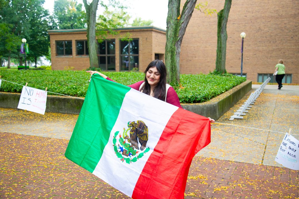 A woman with Mexico's flag at Convocation and Celebration