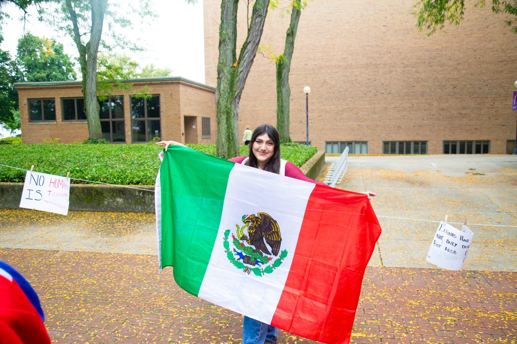 A woman with Mexico's flag at Convocation and Celebration