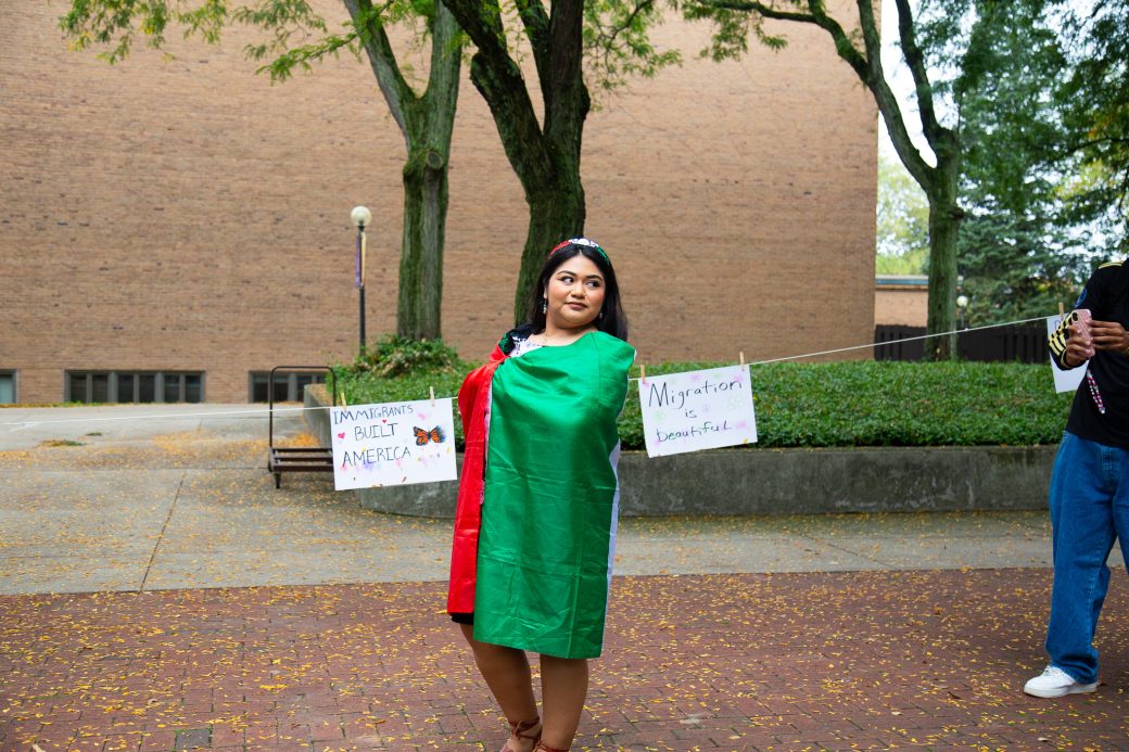 A woman with Mexico's flag at Convocation and Celebration