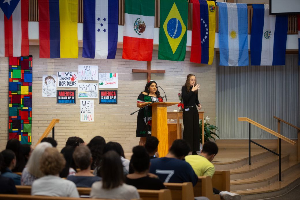 Woman having a speech at the stage's pulpit at Hispanic Heritage Month Convocation and Celebration