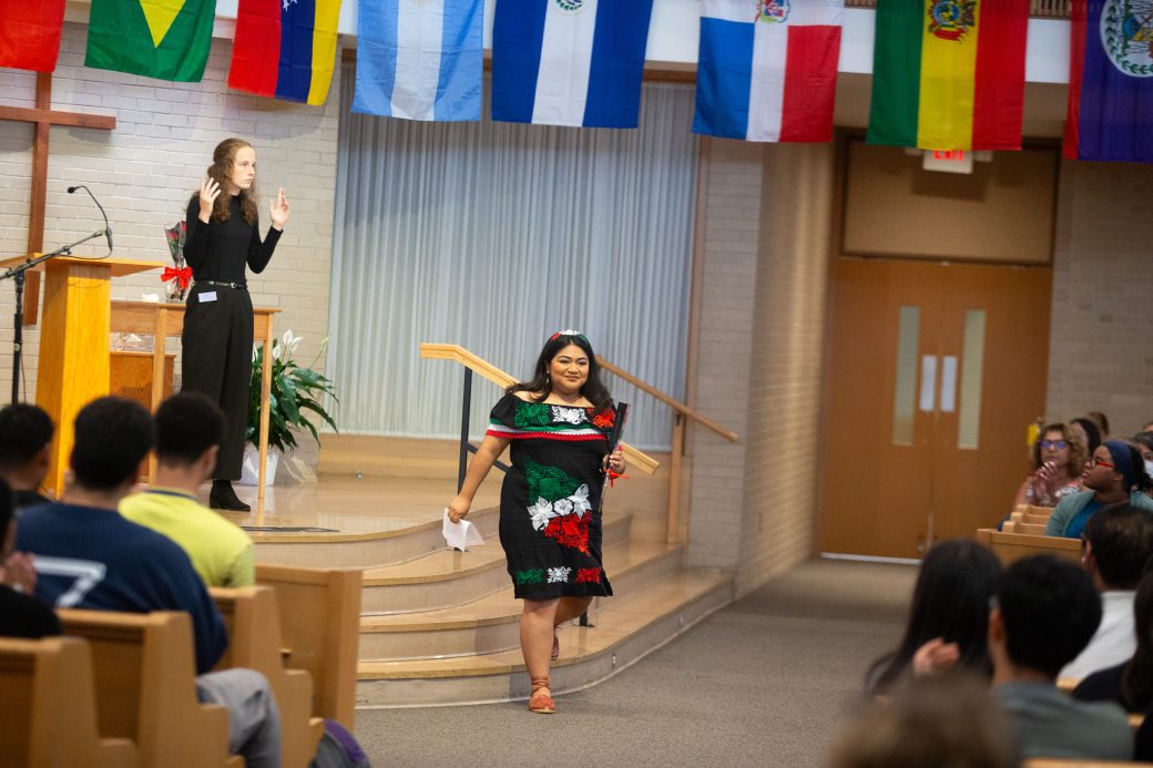 Woman walking at Hispanic Heritage Month Convocation and Celebration