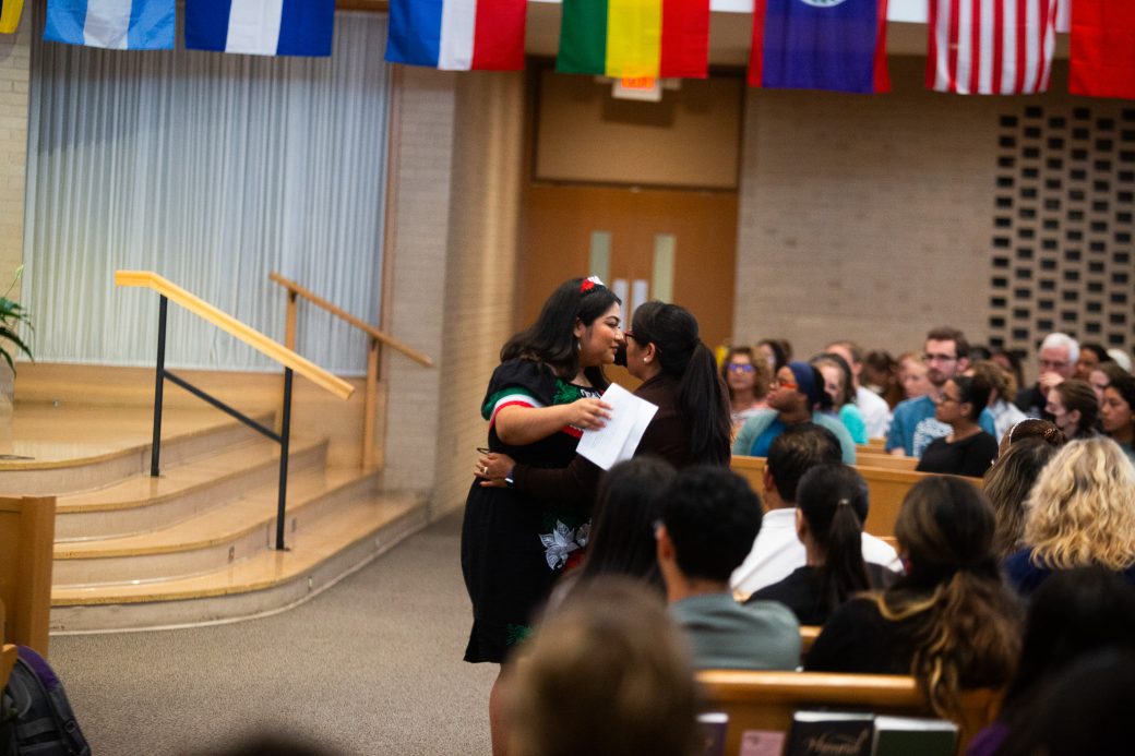 Two woman hugging at Hispanic Heritage Month Convocation and Celebration