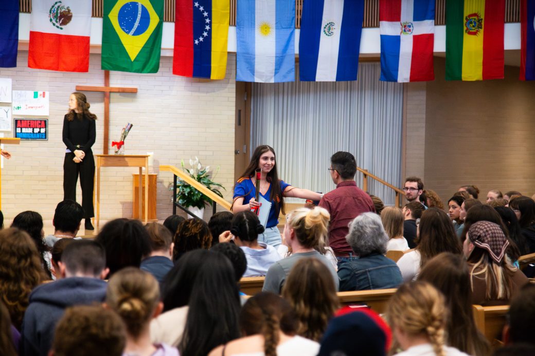 Woman and man almost hugging at Hispanic Heritage Month Convocation and Celebration