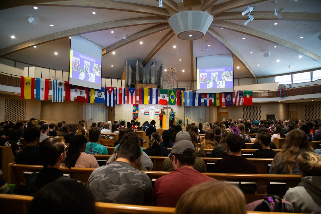 Public pay attention at Woman having a speech at Hispanic Heritage Month Convocation and Celebration