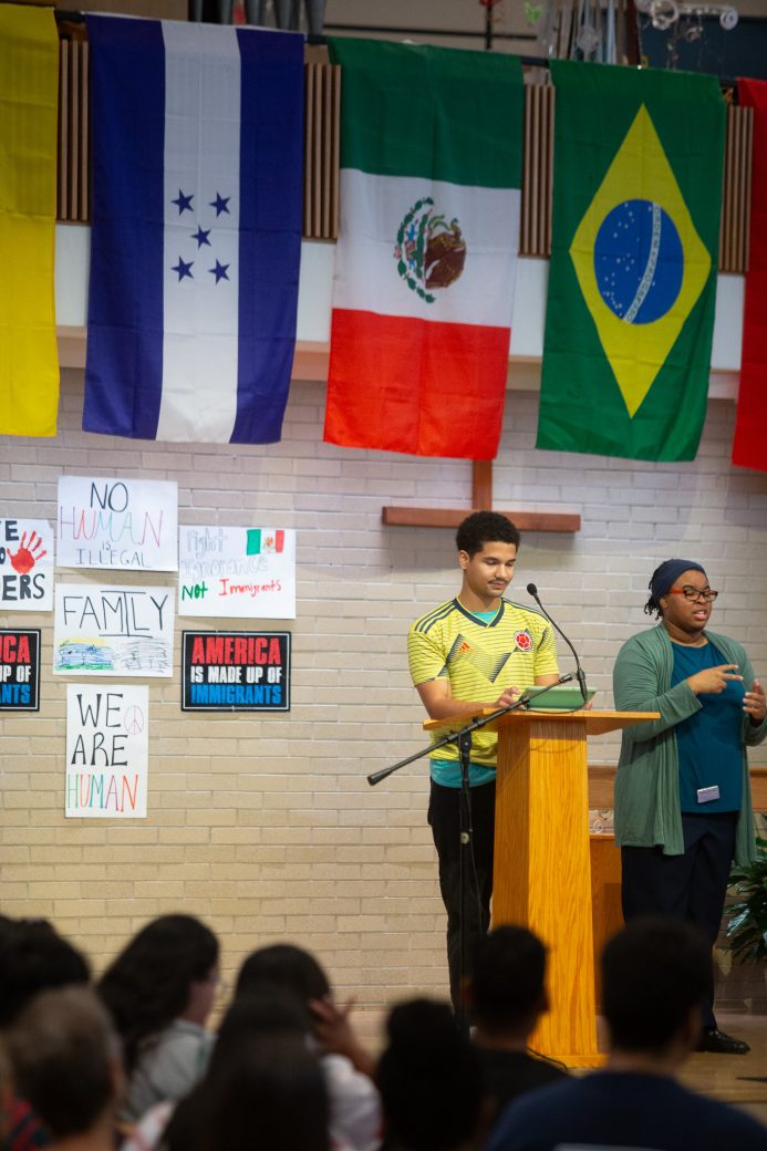 Men having a speech at pulpit at the Hispanic Heritage Month Convocation and Celebration