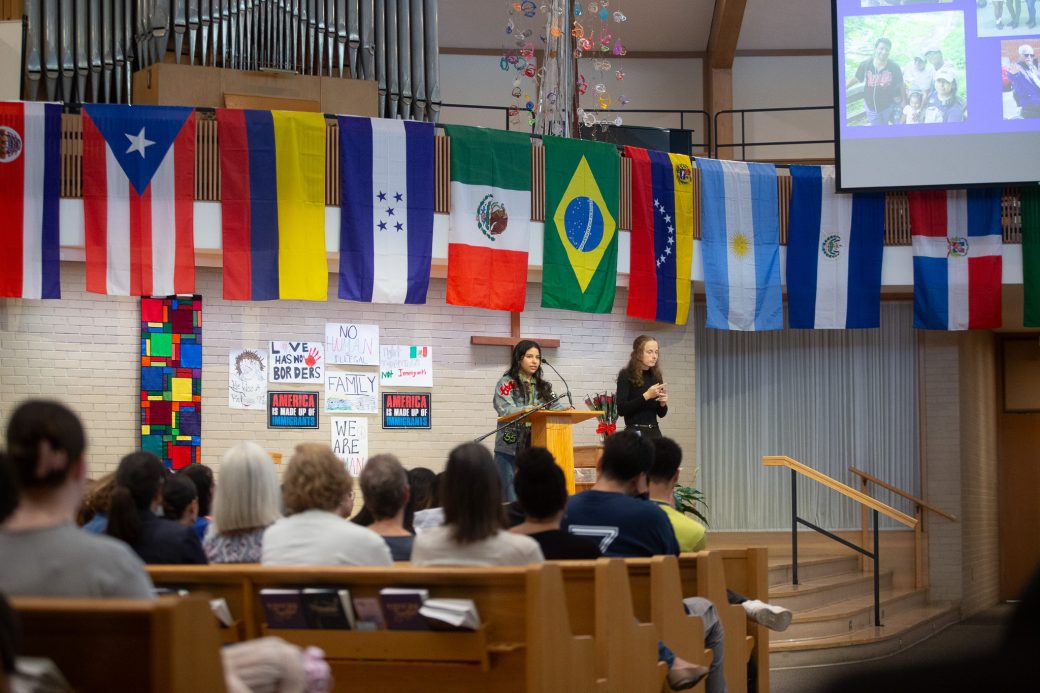 Woman having a speech at the stage's pulpit at Hispanic Heritage Month Convocation and Celebration