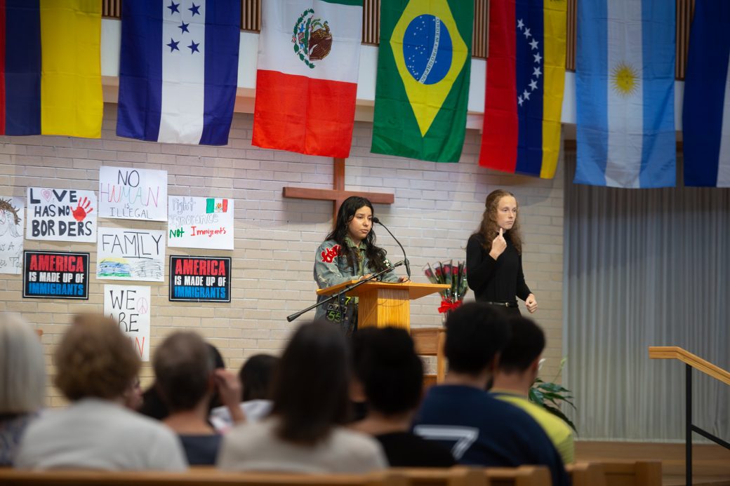 Woman having a speech at the stage's pulpit at Hispanic Heritage Month Convocation and Celebration