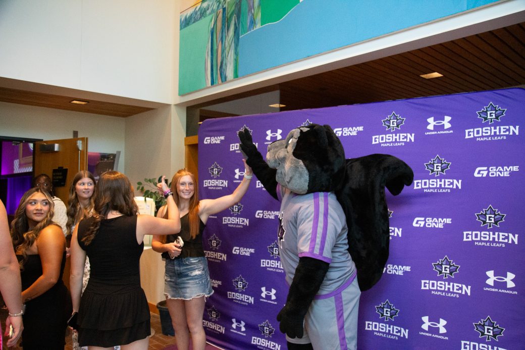 Dash high-fiving student