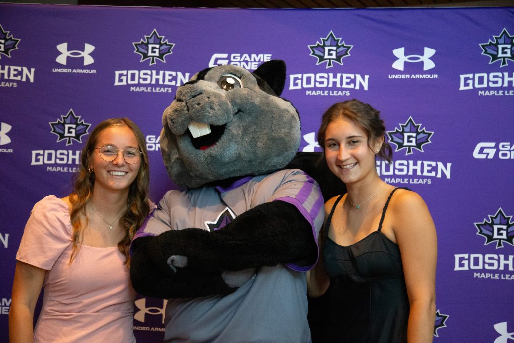 Dash posing with attitutde with female students