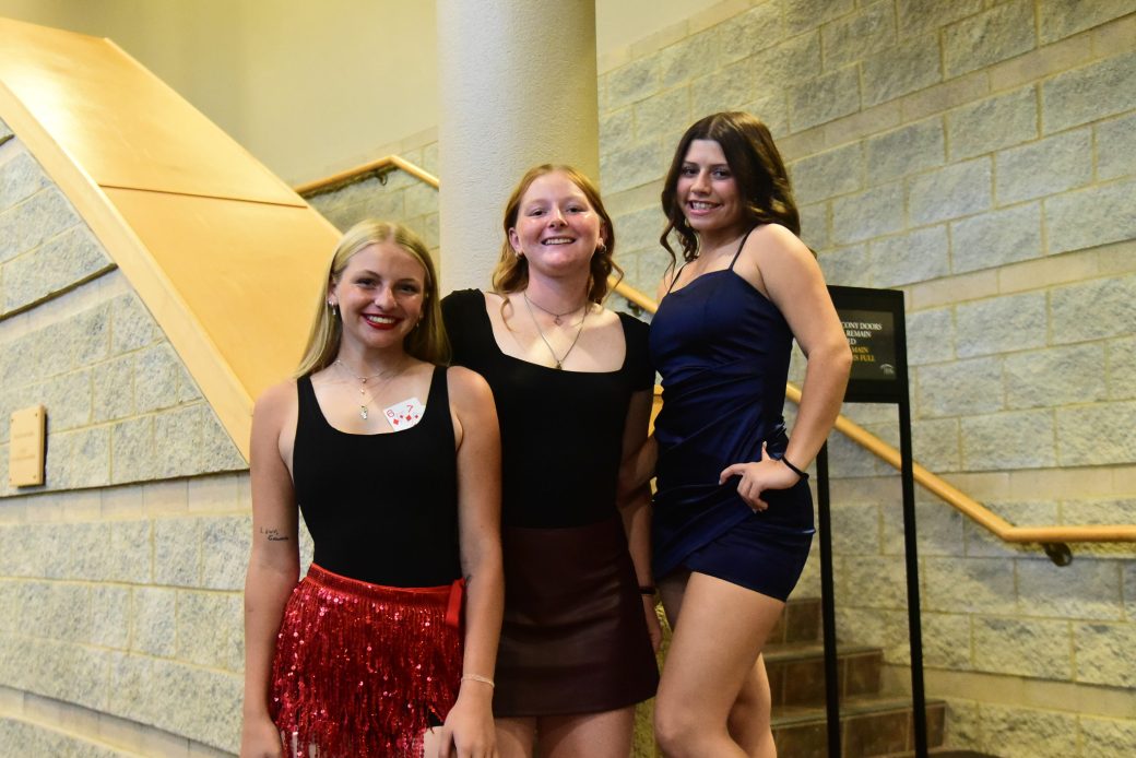 Three women smiling at the camera at 2025 Goshen's College kick off