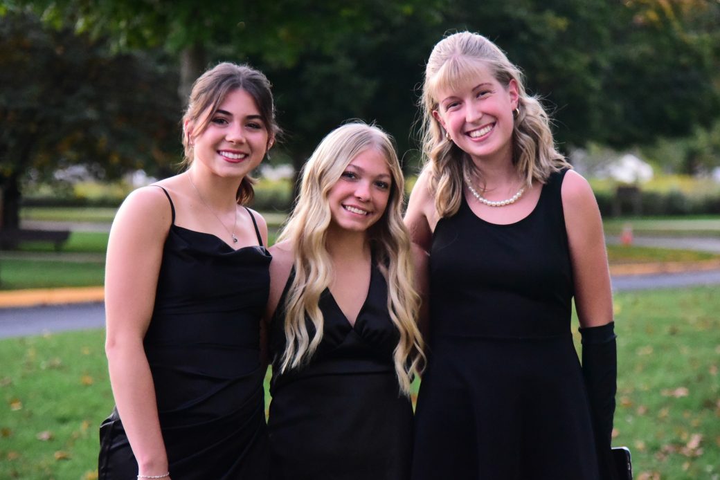 Three woman smiling to the photo at 2025 Goshen's College kick off