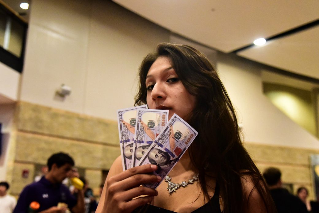 Woman showing money at Goshen college