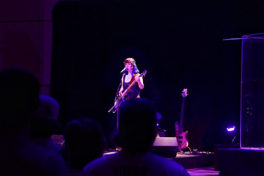 Woman singing at the stage of Goshen college
