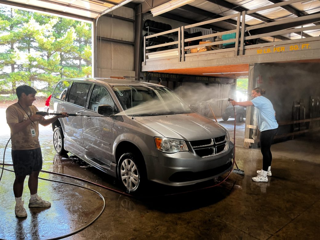 two men washing a car