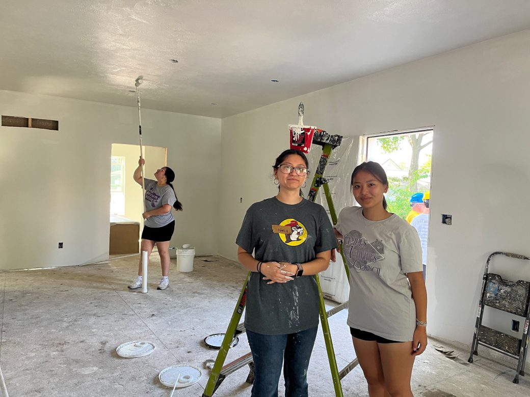 Two women hugging at the house