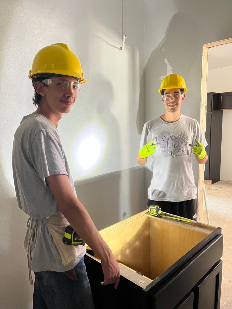 Mens carrying a shelf