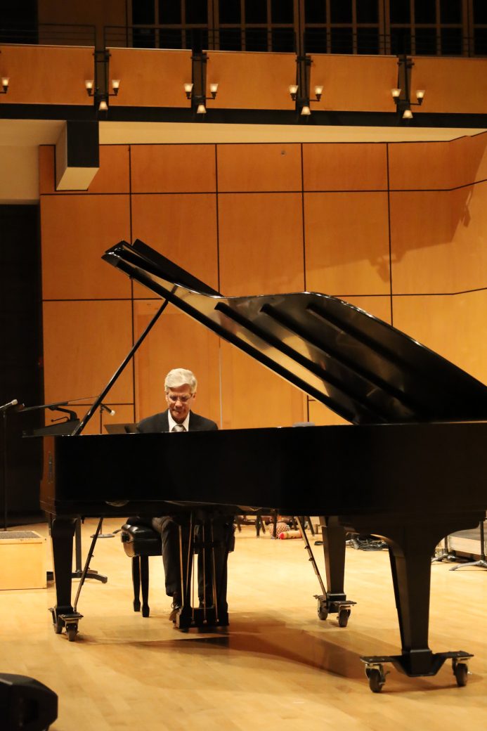 Pianist performs on stage