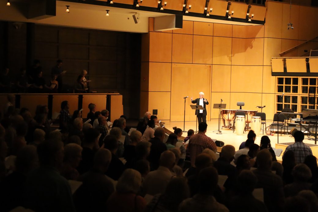 Audience stands and participates in sing along performance