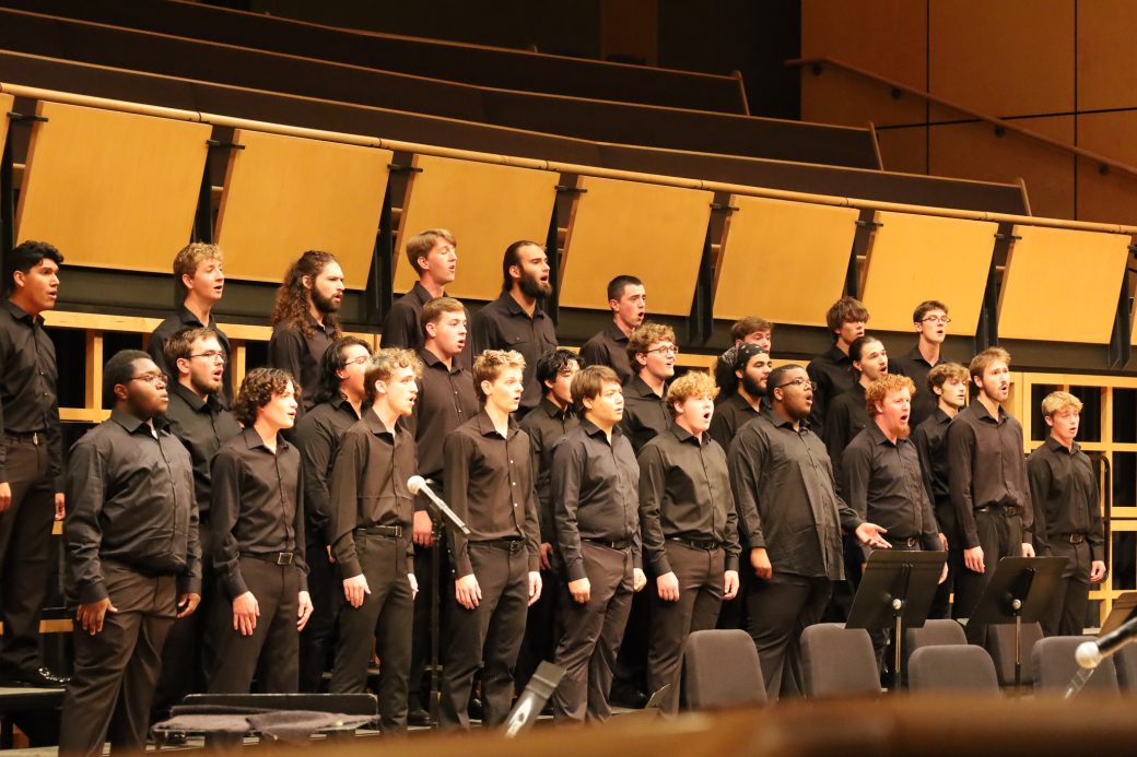 Students performing during homecoming gala, group shot