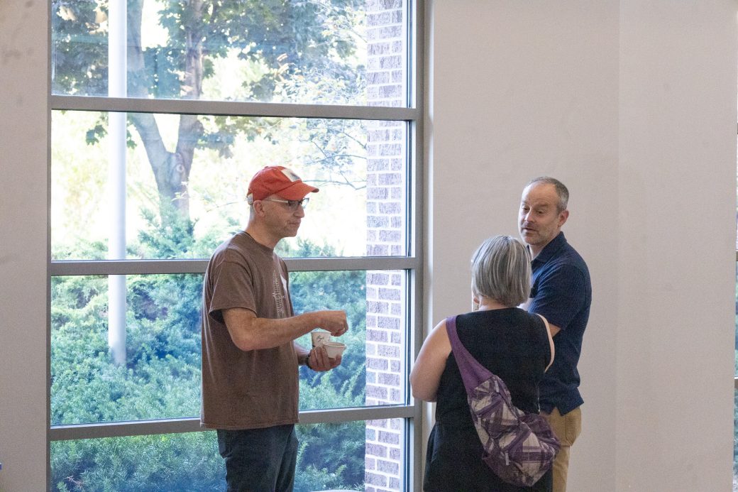 People talking at the Goshen college