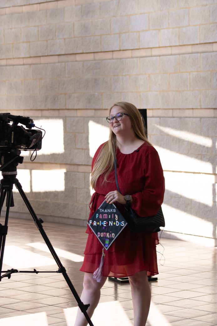 Goshen college alumini smiling to the camera