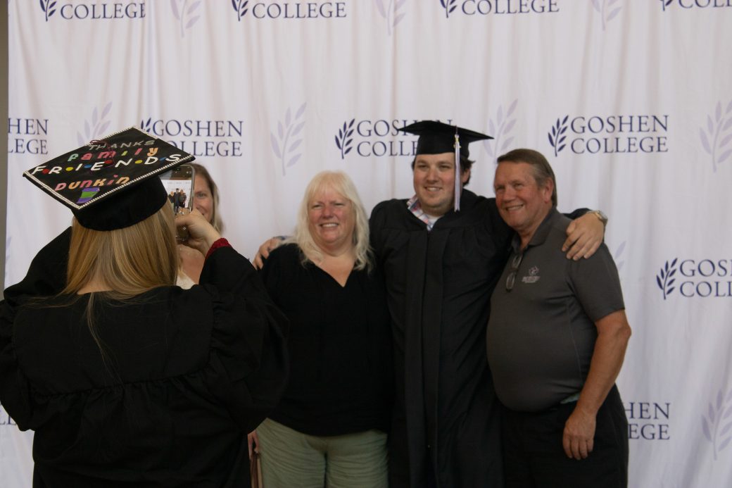 Woman taking a photo of a family