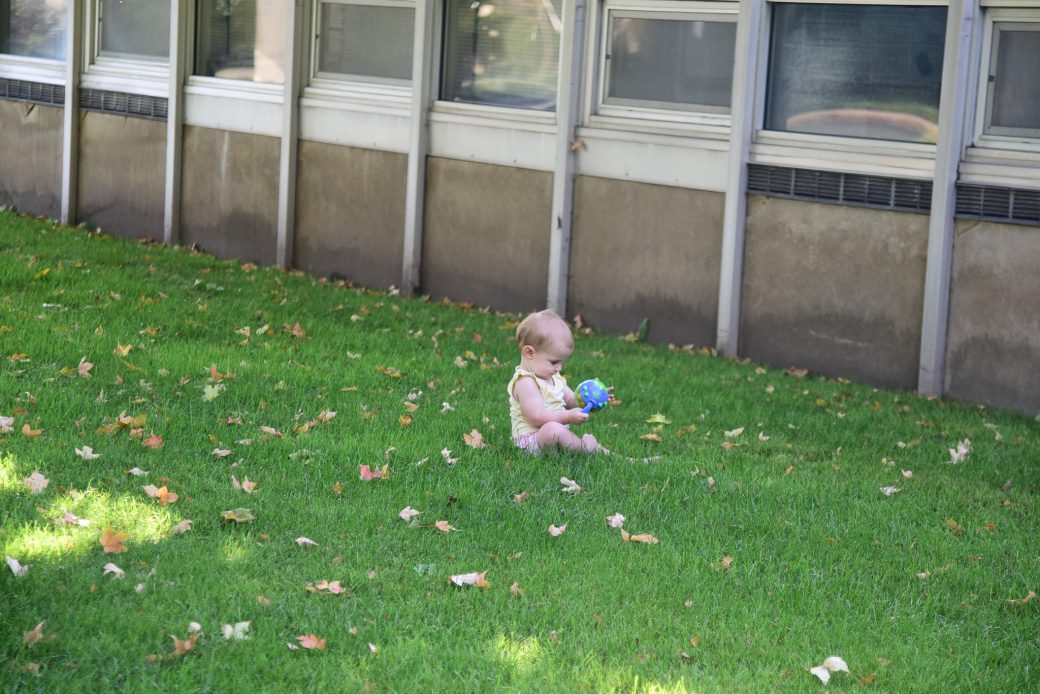 Baby playing with a ball at Goshen college