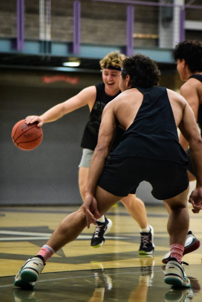 two male players on opposite teams face off