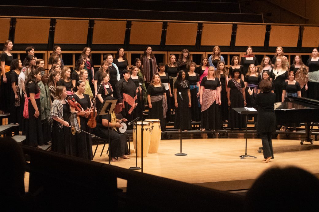 Wider group shot of Voices of the Earth performing