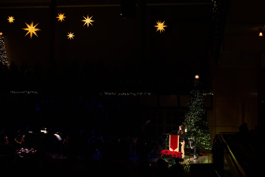 Speaker by a Christmas tree