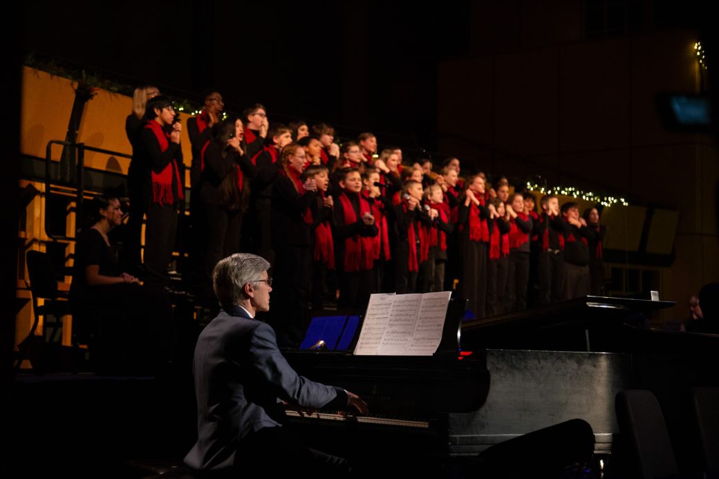 Piano played in front of singers