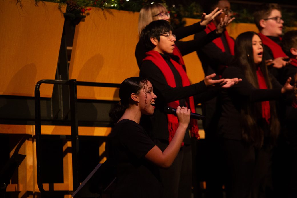 Solo singer next to choir