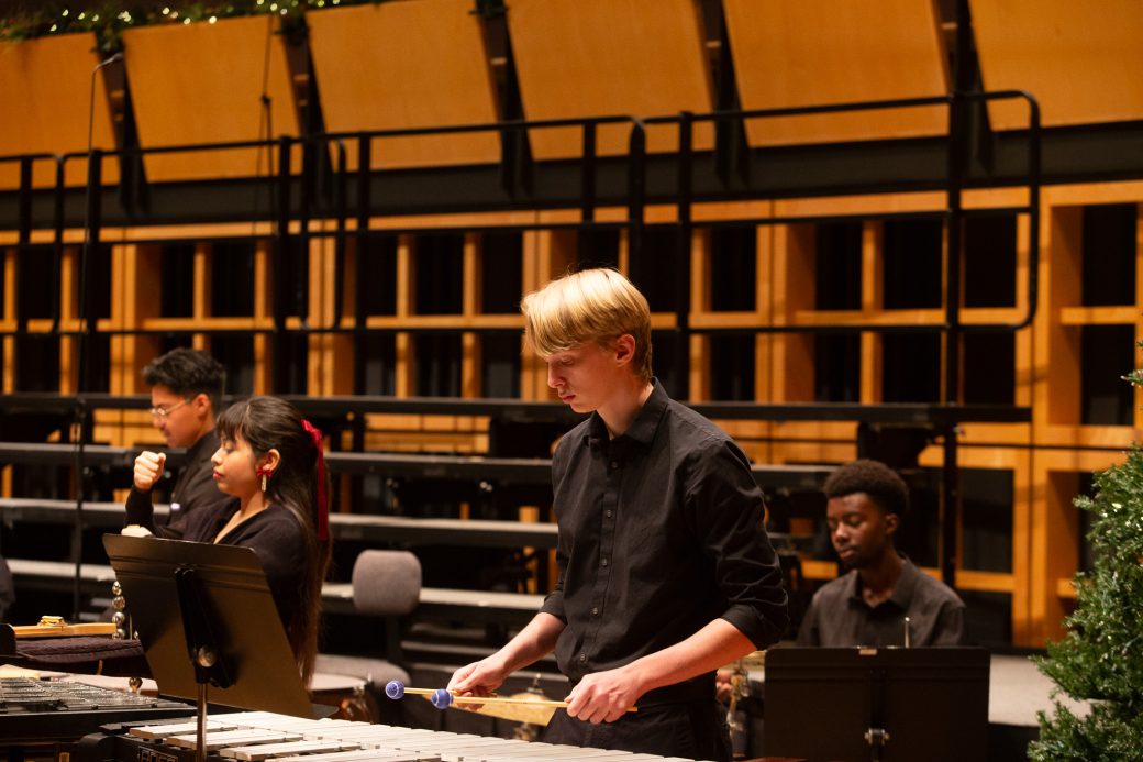 Student plays xylophone
