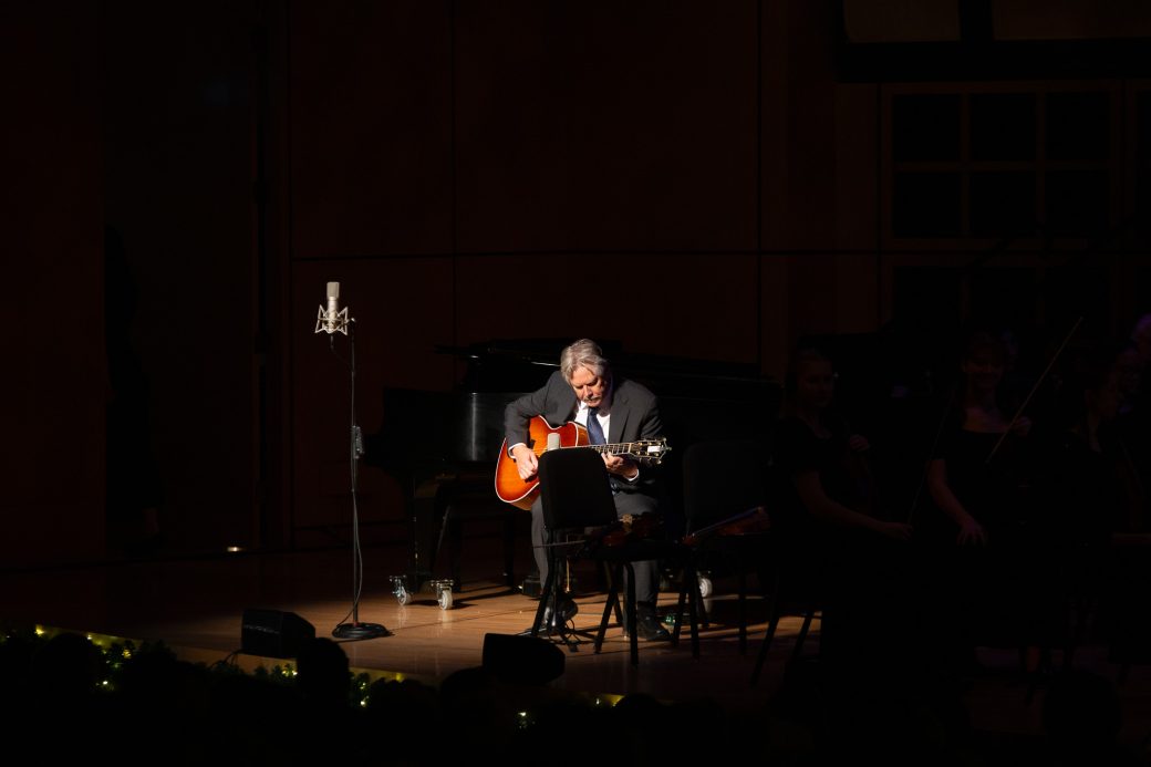 Man plays guitar