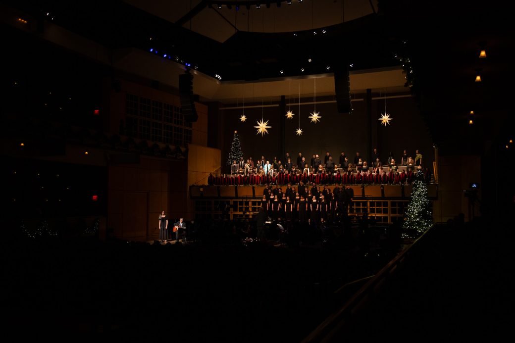 Choirs in dark concert hall