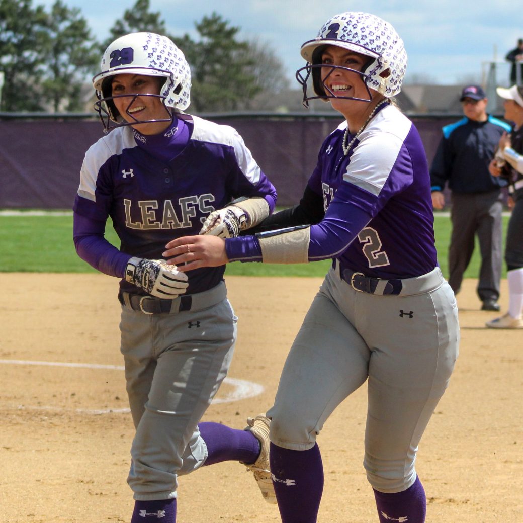 Women's softball team members celebrate