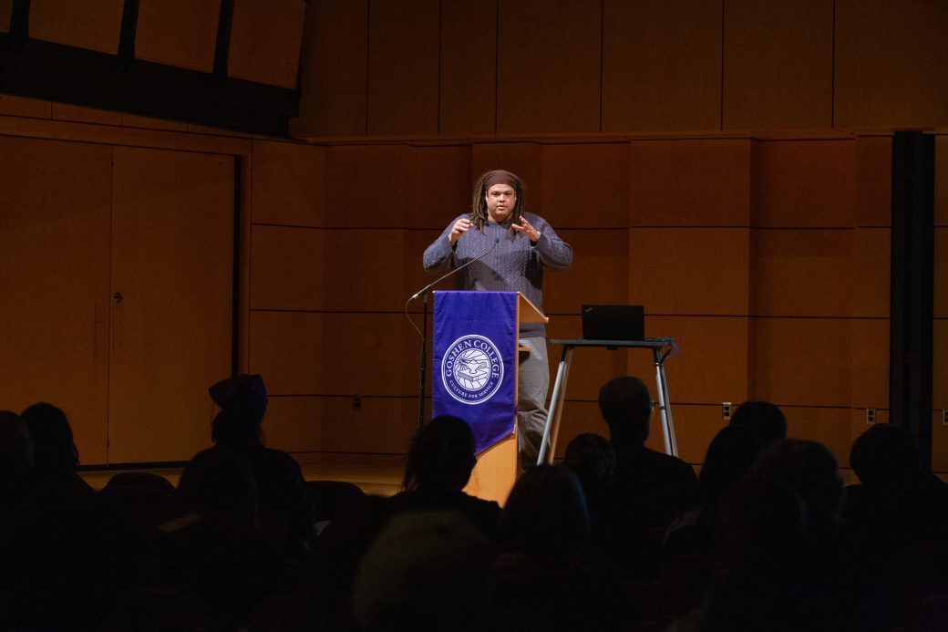Scott speaking at a lectern in front of people