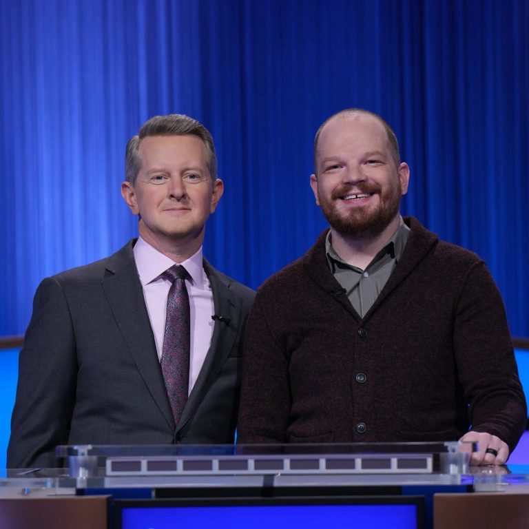 Ben Ganger smiling next to Jeopardy! host Ken Jennings