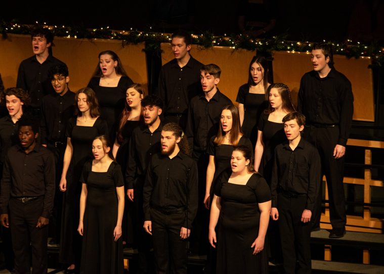 Students dressed in concert black singing in a choir