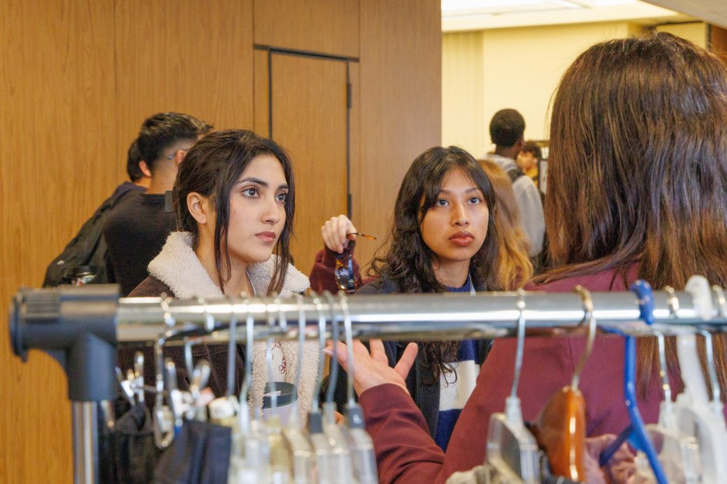 Students listening to booth member speak.