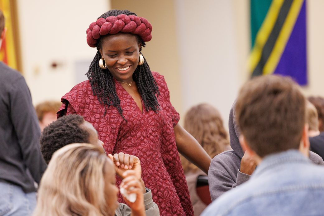 Woman smiling in conversation.