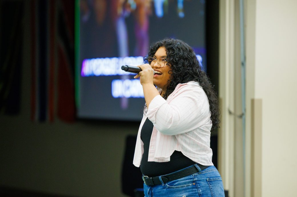 One woman singing into microphone.