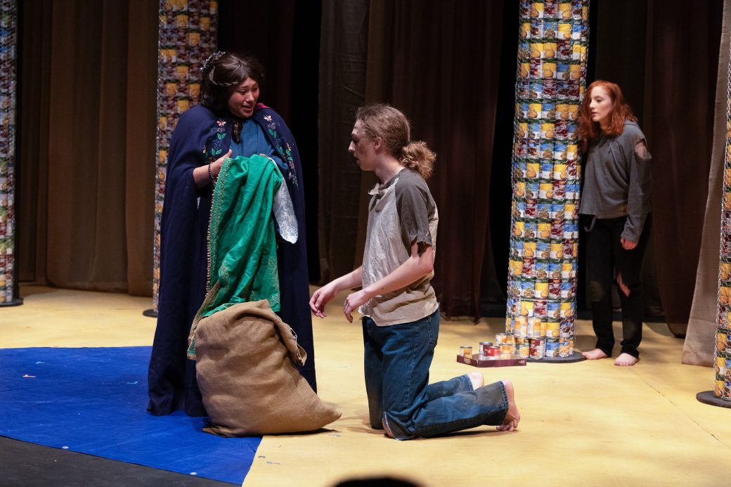 actors handing over clothes