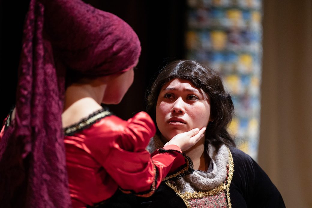 actor consoling another actor holding her face