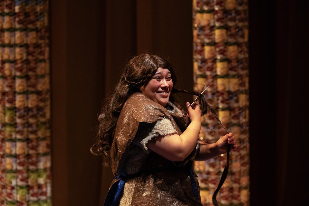 actor smiling and cutting off her own hair