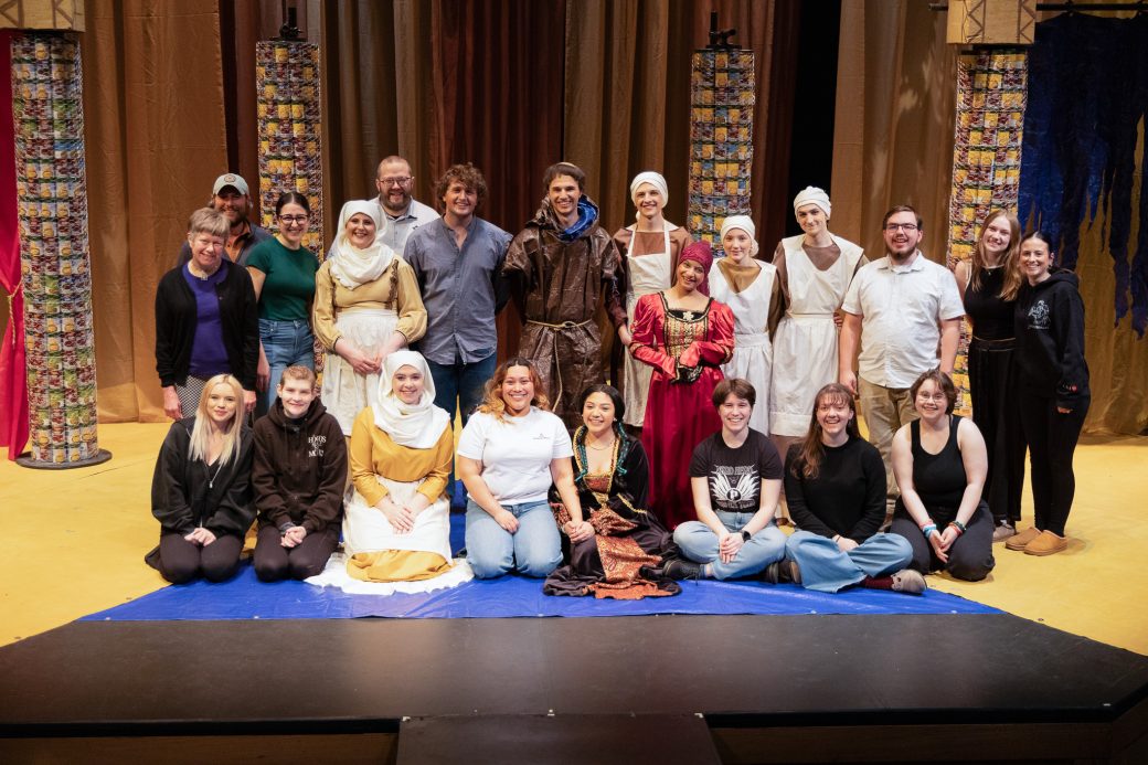 group photo of actors smiling