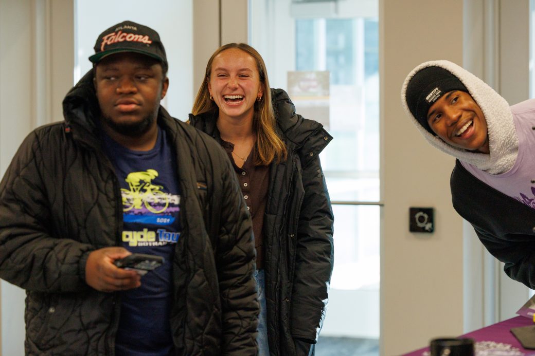 Students laughing at the Connect Goshen Day table